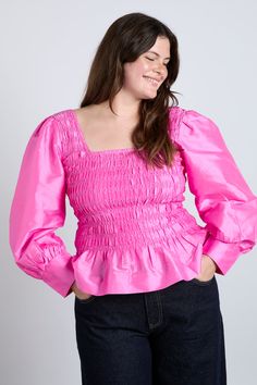 Our pink Ariana blouse boasts puff sleeves, a shirred bust and feminine bow details. •Shirred bodice •Long puff sleeves •Back bow detail •Select your normal size •100% Recycled Polyester •Designed in London MODEL INFO: Model is 1 is 5'10.5 and is wearing a UK 10. Model is 2 is 5'9 and is wearing a UK 16. Pink Fitted Puff Sleeve Top, Pink Puff Sleeve Blouse With Smocked Cuffs, Pink Fitted Puff Sleeve Top With Balloon Sleeves, Pink Ruffled Puff Sleeve Blouse, Spring Pink Puff Sleeve Top With Gathered Sleeves, Pink Puff Sleeve Blouse With Ruffles, Pink Puff Sleeve Top With Gathered Sleeves, Pink Tops With Puff Gathered Sleeves, Feminine Pink Puff Sleeve Top