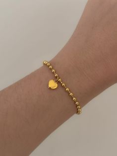 "Ball Chain Heart Bracelet ✨💕 18k gold plated stainless steel ball chain bracelet Made with a unique puffed gold heart charm Length can be adjusted with the extender!  6\" with extender 😊" Gold Heart Bracelet Tarnish Resistant, Everyday Gold Charm Bracelet For Valentine's Day, Tarnish Resistant Heart Chain Bracelet, Minimalist Gold Charm Bracelet With Heart, Gold Dainty Heart Charm Bracelet, Gold Heart Bracelet For Everyday Wear, Gold Tarnish Resistant Heart Bracelet For Valentine's Day, Gold Heart Jubilee Bracelet, Gold Jubilee Heart Bracelet