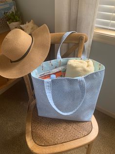 "Sand and Sun Roomy Beach Tote, Shopping or Market Bag!  This roomy bag with a fun summer seaside print to carry all of your necessities for that lounge Beach Day.  Plenty of space for beach towel, sunscreen, foldable hat, zipper pouch, snacks and water plus more!  Simple design, machine washable and dryable.  Iron if you wish for that crisp look.   ☀️ SIZE 20\" wide x 13.5\" tall x 7\" deep flat bottomed ☀️ FEATURES I used quality 100% cotton fabrics for the exterior and interior for the beach themed bag, and a sturdy stabilizer for the structure of the bag.  The handles are 17\" in length.   ☀️ CARE This bag is completely machine washable and dryable on low heat.  You may touch it up with an iron if you  prefer that crisp look. ☀️ GIFT I will be happy to ship your item directly to your g Blue Bags For Weekend Trips, Blue Bags For Weekend Trips In Summer, Large Capacity Shoulder Bag For Summer Weekend Trips, Reversible Blue Shoulder Bag For Beach, Reversible Blue Shoulder Bag For The Beach, Summer Beach Bag With Pockets, Summer Rectangular Beach Bag For Weekend Trips, Rectangular Summer Beach Bag For Weekend Trips, Summer Beach Bag With Pockets For Vacation