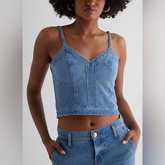 Description A Denim Corset Moment Is The Perfect Pick For The Season. The Flattering Fit And Chic Corset Detailing Come Together To Create This Ultra Stylish Top. Features & Fabric Sweetheart Neckline Spaghetti Straps Back Zipper Closure Denim Fabric; Corset Bodice Straight Hem; Cropped Length 91% Cotton/8% Recycled Cotton/1% Spandex Imported Fitted Denim Crop Top, Casual Style, Casual Fitted Denim Crop Top, Dark Wash Cropped Denim Tops, Cropped Light Wash Denim Top, Cropped Denim Blue Top, Cropped Denim Top In Light Wash, Light Wash Cropped Denim Top, Cropped Medium Wash Denim Top, Medium Wash Cropped Denim Top