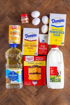 eggs, milk, yogurt, and other ingredients on a wooden table top