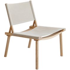 a white chair with wooden legs and a seat cushion on top of it, in front of a white background