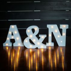 light up letters that spell out the word a and v on a table with lights