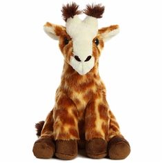 a giraffe stuffed animal sitting on top of a white floor