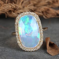 "\"Details: Item code :- ATR-2400 - 14K yellow solid gold (as shown) wt :1.60 gm - 0.32 ct diamonds - 3.19 ct opal - Ring size 20 x 13 mm & ring size 7 us Anjis touch jewelry supports ethical and eco-friendly practices and uses reclaimed and recycled metals whenever possible About my jewelry: All of the Anjis touch jewelry collection is handmade exclusively by me.  I hope that you will enjoy wearing my designs as much as I enjoy making them! Shipping: We have this in stock which we can ship in 2 Luxury Adjustable Opal Ring For Gift, Luxury Elegant Cluster Opal Ring, Luxury Brilliant Cut Yellow Gold Opal Ring, Luxury Yellow Gold Brilliant Cut Opal Ring, Cocktail Christmas, Boulder Opal Ring, White Diamond Earrings, Unique Rings Vintage, Colored Stone Rings