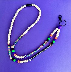 What a spooky way to start your day! This listing is for the personalized lanyard only. The bead colors will include, purple, lime green, bright orange, black, and wood beads (look at pics). The small focal beads within the lanyard will vary but will be Halloween themed.  Lanyard length can be chosen from the drop down menu. 18 inches is standard. This measurement goes from the breakaway clasp to the bottom bead (does not include the jump ring and clasp)  Letters for personalization can be white with black as shown in the pics. Name/Wording will be placed top to bottom (see pic) You can personalize it with a name, phrase, or special wording. Use the personalization section to personalize your item. This listing will stay true to the color combo used in the pics. If you'd like something els Personalized White Lanyards For Everyday Use, Personalized Black Lanyards As Gift, Personalized Black Lanyard For Gift, Personalized Black Lanyards For Gifts, Customizable White Lanyards, Personalized White Lanyards For School, Customizable Adjustable White Lanyards, White Adjustable Fun Lanyards, White Beaded Lanyard For Personal Use