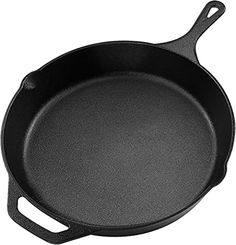 an empty cast iron skillet on a white background