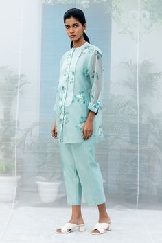 Mint shirt with sakura floral prints, embroidered highlights and criss-cross stitch line yoke. Comes with pant and slip. - Aza Fashions Spring Festive Blouse With Set-in Sleeves, Spring Festive Chikankari Pant Set, Blue Floral Embroidery Pant Set For Spring, Blue Floral Embroidered Pant Set For Spring, Festive Spring Blouse With Set-in Sleeves, Blue Pant Set For Spring Workwear, Traditional Spring Workwear Sets, Blue Chikankari Embroidery Sets For Spring, Embroidered Straight Pant Set For Spring