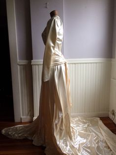 "Custom designed wedding gown from the late 1940's (1948-49) . Made for a woman who was approximately 115- 120 lbs and approximately 5'7\" tall. This gown could have be made by designer Caroline Herrera the workmanship and simple elegance screams her namesake. The icy pink satin is stunning in this gowns design, as is the pleated bustle back. Measurements are; Armpit to armpit Waist Feel free to convo me with any further questions. Thank you for your interest." Fitted Wedding Dress With Historical Design, Vintage Fitted Gown With Historical Design, Vintage Gown With Fitted Bodice For Wedding Night, Vintage Cream Wedding Dress With Fitted Bodice, Vintage Wedding Dress With Fitted Bodice, Fitted Wedding Gown With Historical Design, Cream Vintage Wedding Dress With Fitted Bodice, Cream Vintage Wedding Dress For Vintage Events, Vintage Floor-length Wedding Gown