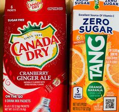 two boxes of canada dry and orange juice