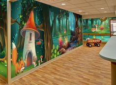 the children's playroom is decorated with colorful murals