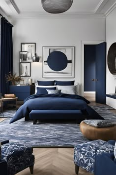 a bedroom with blue and white decor on the walls, bedding, and furniture