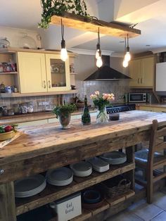 a kitchen island with pots and pans on it