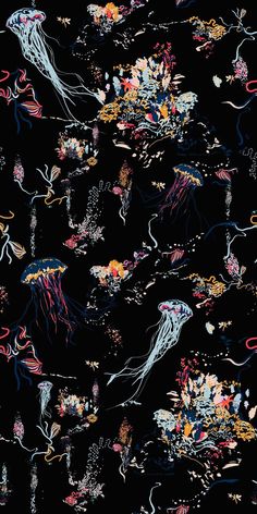 a black background with jellyfish and other marine creatures on it's surface, all in different colors