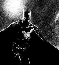 a black and white photo of batman in the dark