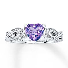 a heart shaped amethorate and diamond ring