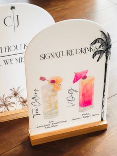 there are two signs that say signature drinks and one has a palm tree on it