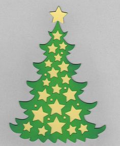 a green and yellow christmas tree with stars on the top is cut out to look like an ornament