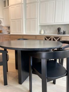 a kitchen table with two chairs around it