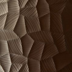 an abstract wallpaper with wavy lines in brown and beige colors, as well as the background