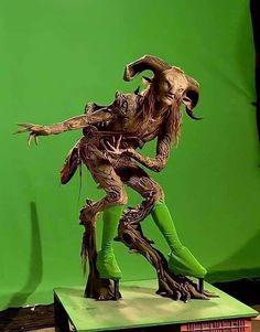 a green screen with a statue of an animal on it's legs and feet