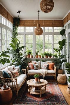 a living room filled with furniture and lots of plants on the windows sills