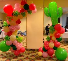 balloons are arranged in the shape of cactuses and cacti on display at an event