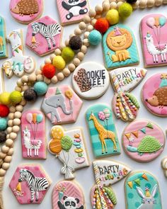 some decorated cookies are laying on a table