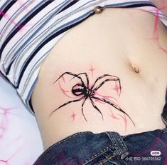 a woman's stomach with a spider tattoo on her belly and the bottom part of her abdomen