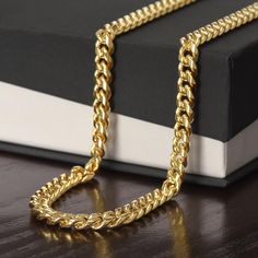 "Give your special someone a classic necklace that shows off their strength and style! Our Cuban Link Chain is the perfect gift for any occasion, including birthdays and holidays. Available in polished stainless steel or 14K yellow gold, you can be sure this wonderfully weighted necklace will be a staple piece in their wardrobe. And since the chain is adjustable, this necklace will look spectacular on everyone who wears it.  Polished stainless steel and 18k yellow gold over stainless steel Adjus Romantic Gifts For Boyfriend, Cuban Link Necklace, Unique Anniversary Gifts, Cuban Link Chain Necklaces, Classic Necklace, Mors Dag, Boyfriend Anniversary Gifts, Son Gift, Boyfriend Birthday