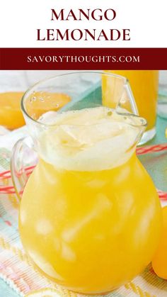 a pitcher of mango lemonade sitting on top of a table