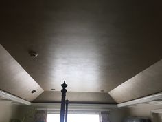 the ceiling in this bedroom is painted gray