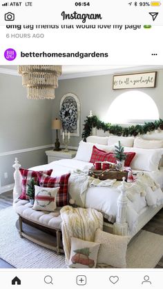 a large bed sitting in a bedroom next to a christmas wreath on top of it