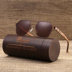 "PRODUCT INFO: * Personalized classic unisex wooden aviator sunglasses and an optional bamboo sunglasses box * Front frame is made of metal (not full wooden sunglasses); temples are made of zebrawood; smooth finish; light weight * With spring hinges, they fit most of the faces comfortably * Free engraving on temples (can be done on left or right or both sides) and box * Great keepsake gifts from different occasions, such as birthday, wedding, xmas etc Unique groomsman gifts are available in my s Groomsmen Watches, Groomsmen Gifts Unique, Engraved Wooden Boxes, Wedding Sunglasses, Groomsmen Gift Set, Wooden Glasses, Personalized Sunglasses, Sunglasses Box, Bamboo Sunglasses