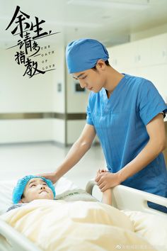 a man in scrubs is being assisted by a nurse