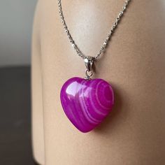 Magenta pink heart pendant. This stone is not only bright and beautiful, but also has some healing powers. The energies of Agate will calm, elevate, and uplift you. Even if you're having a very busy and hard day, you will still be able to relax and find peace and solitude. Also, agate is considered a protective stone. It is believed to attract strength and offer protection from bad dreams, stress and the draining of energy.  This is a great gift for your girlfriend that will show her your feelin Pink Heart Gemstone Pendant Necklace, Pink Gemstone Heart Necklace Gift, Pink Gemstone Heart Necklace For Gift, Pink Heart Gemstone Necklace For Gift, Heart-shaped Agate Healing Jewelry, Heart-shaped Agate Jewelry For Healing, Healing Heart-shaped Agate Jewelry, Pink Agate Necklace Gift, Pink Agate Necklace For Gifts