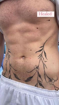 a man's stomach with tattoos on it and the words healed written in white