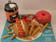 a birthday cake made to look like a hot dog and fries