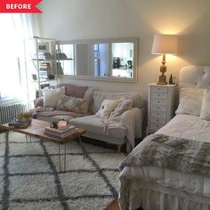 a living room filled with furniture and a large mirror on the wall above it's headboard