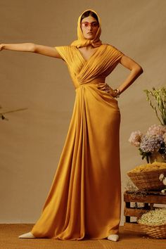 Mustard voile full length dress with criss cross pleated bodice. - Aza Fashions Elegant V-neck Maxi Dress With Pleated Back, V-neck Ruched Maxi Dress For Wedding, Pleated V-neck Dress For Gala, Floor-length Pleated Maxi Dress For Wedding Guest, Pleated V-neck Maxi Dress For Gala, V-neck Maxi Dress With Pleated Back For Gala, V-neck Maxi Dress With Pleated Back For Wedding, Pre-draped V-neck Dress With Pleated Bodice, Pre-draped V-neck Maxi Dress For Cocktail