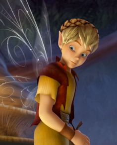 a young boy dressed as tinkerbell holding a wand