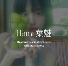 a woman holding a glass with grapes in it and the words i ami meaning fascinating leaves origin japanese