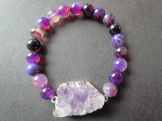 This listing is for one Electroplate Amethyst and Agate Bracelet.This bracelet is absolutely stunning!!! The stock picture is of size 7 inches. Please write in notes to seller if you prefer a different size.I ship all additional items for free as long as they are paid for on the same invoice.https://www.etsy.com/shop/mizzoktober?section_id=12727539&ref=shopsection_leftnav_2Thanks for looking and HAVE A GREAT DAY!!!!!! Purple Agate Bracelets, Adjustable Purple Agate Beaded Bracelets, Purple Agate Beaded Bracelets As A Gift, Purple Agate Bracelets With Natural Stones, Purple Agate Bracelet With Natural Stones, Purple Agate Gemstone Beads Bracelets, Purple Agate Bracelets With Gemstone Beads, Purple Agate Gemstone Beads Bracelet, Purple Agate Bracelet With Gemstone Beads