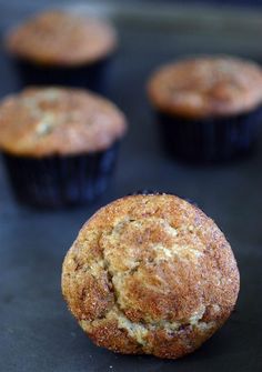 several muffins sitting on top of a black surface