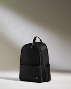 Our classic Chelsea Daypack has been reimagined with extra space. This smart, streamlined backpack has plenty of handy features: a back sleeve that slots over a suitcase handle, a full zip opener for easy packing and access, a zipped front pocket with card sleeve and key clip inside, a 16.5” laptop pocket, and an elasticated side pocket for a water bottle. The zipped, padded laptop pocket has an additional slip pocket for a tablet. Inside the backpack, there’s a removable packing pocket for shoe Blue Suitcase, Small Rucksack, Pink Suitcase, Chelsea Shoes, Suitcase Handle, Large Luggage, Cabin Bag, Easy Packing, Luggage Straps