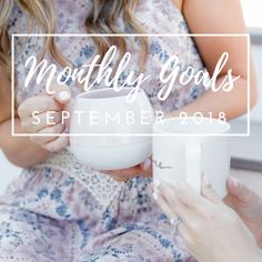 a woman holding a cup in her hands with the words, monthly goals on it