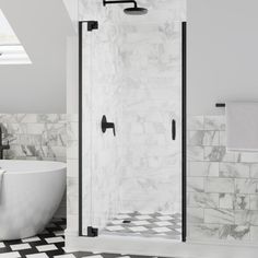 a white bath tub sitting next to a black and white checkered floor