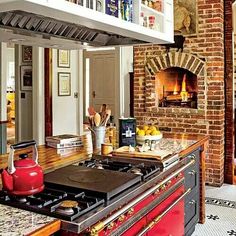 a kitchen with an oven, stove and counter top in the middle of it's center island