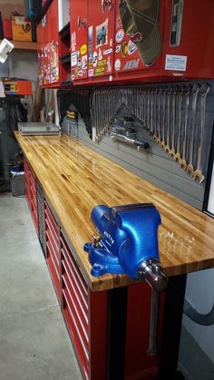 a wooden counter top in a store with tools on it