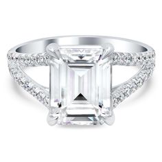 an emerald cut engagement ring with diamond accents